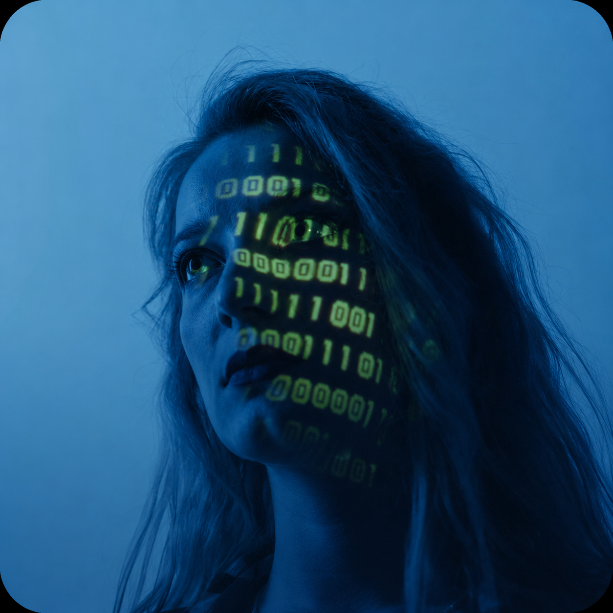 Woman with projected binary code on her face